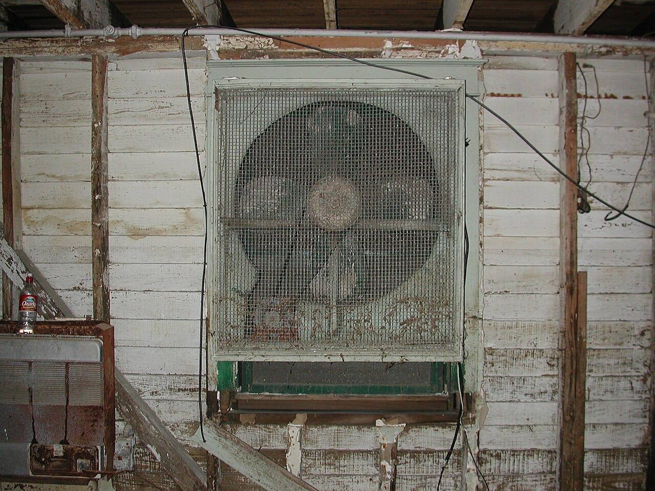 Belt-driven basement fan with a flooded motor in a private property